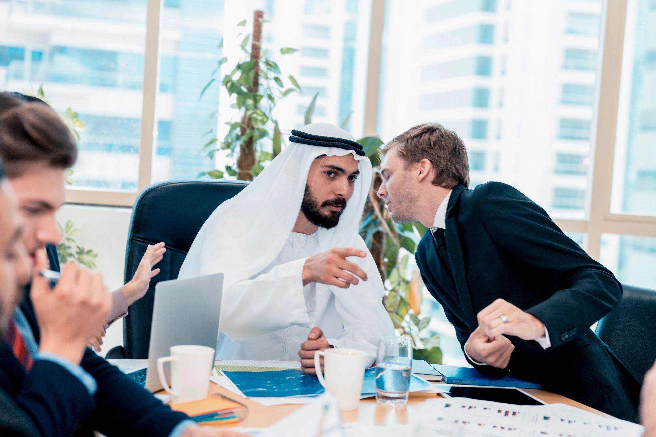 Finance advisory meeting in a modern Dubai office